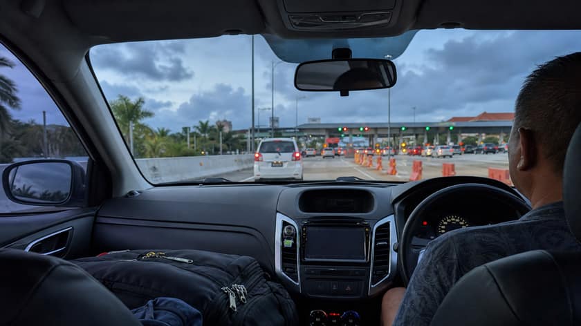 A car leaving Bali airport toward Sanur on the toll road