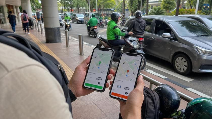 Person using a phone to arrange transport