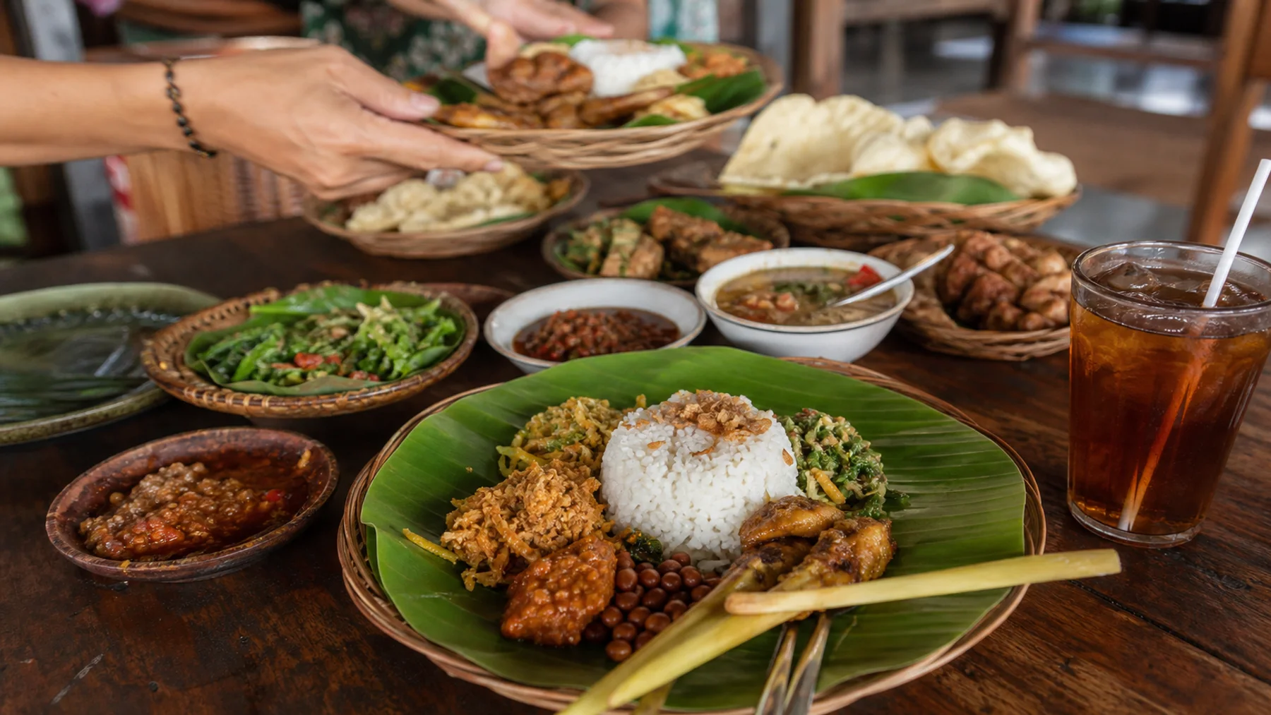 Balinese warung table with nasi campur, satay and sambal