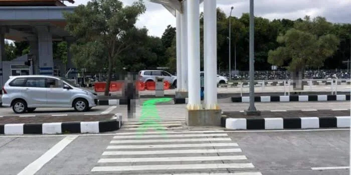 Grab official DPS image showing the pedestrian turn toward the motorbike pickup route.
