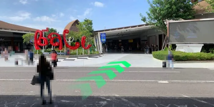 Grab official DPS image showing the domestic arrival park route at Bali Airport.