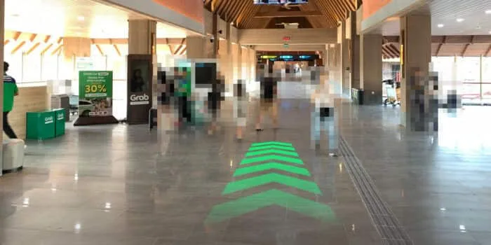 Grab official DPS image showing the walking route toward regular GrabCar pickup.