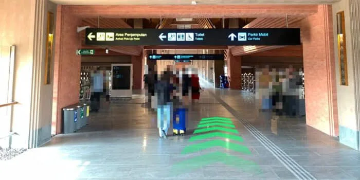Grab official DPS image showing the domestic parking-building route at Bali Airport.