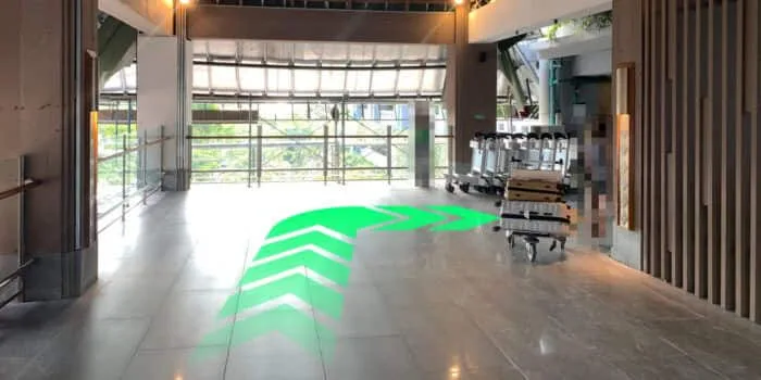 Grab official DPS image showing the turn into the domestic car park at Bali Airport.