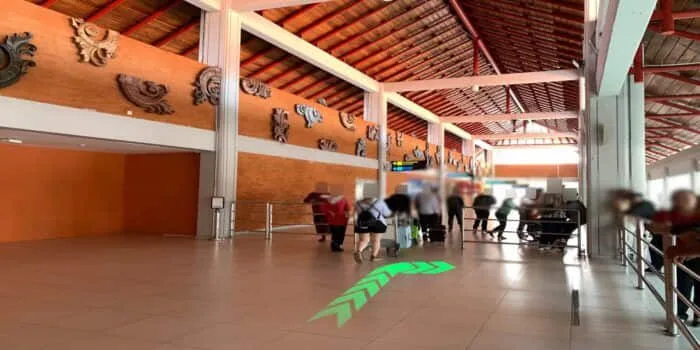 Grab official DPS image showing the turn toward the Bali monument at domestic arrivals.