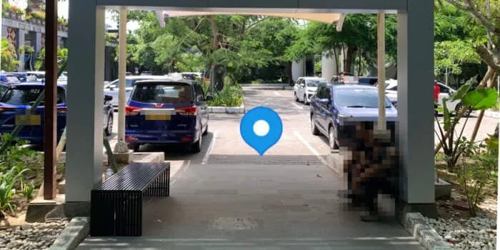 Grab official DPS image showing the international Grab pickup point at Bali Airport.