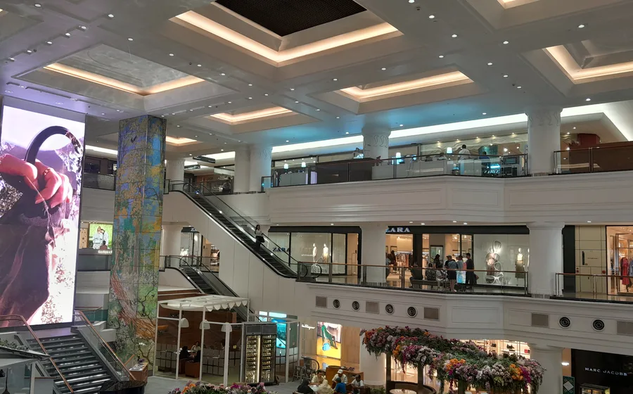 Bright atrium interior inside Plaza Indonesia mall in Jakarta.