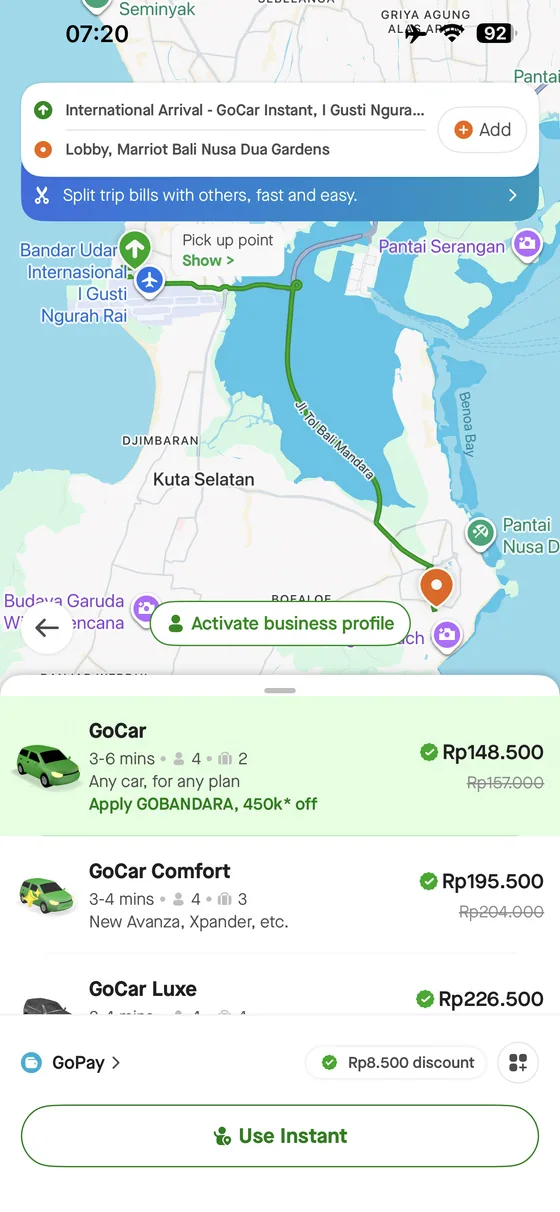 Gojek app quote from Bali Airport to Marriott's Bali Nusa Dua Gardens showing GoCar, Comfort and Luxe options.
