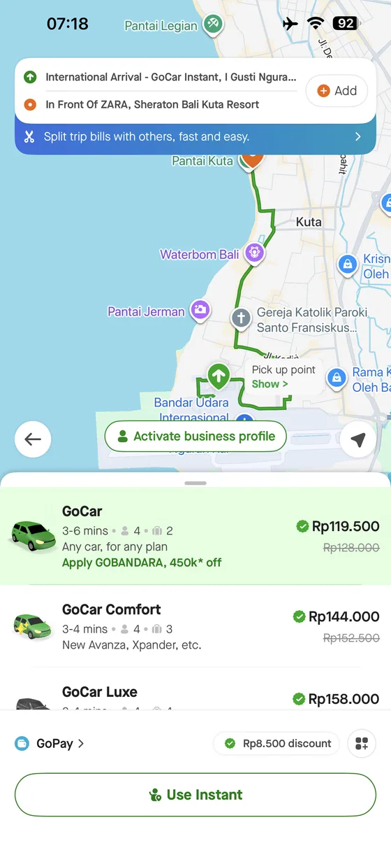 Gojek app quote from Bali Airport to Sheraton Kuta showing GoCar, Comfort and Luxe options.