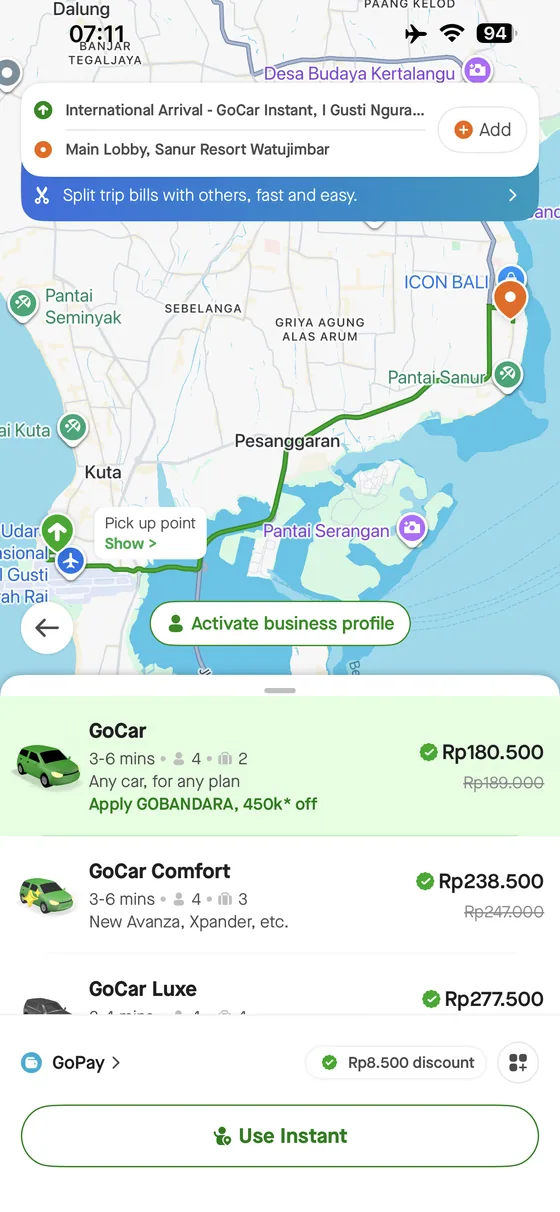 Gojek app quote from Bali Airport to Swiss-Bel Sanur showing GoCar, Comfort and Luxe options.